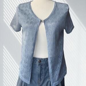 Soft blue sleeveless knit top